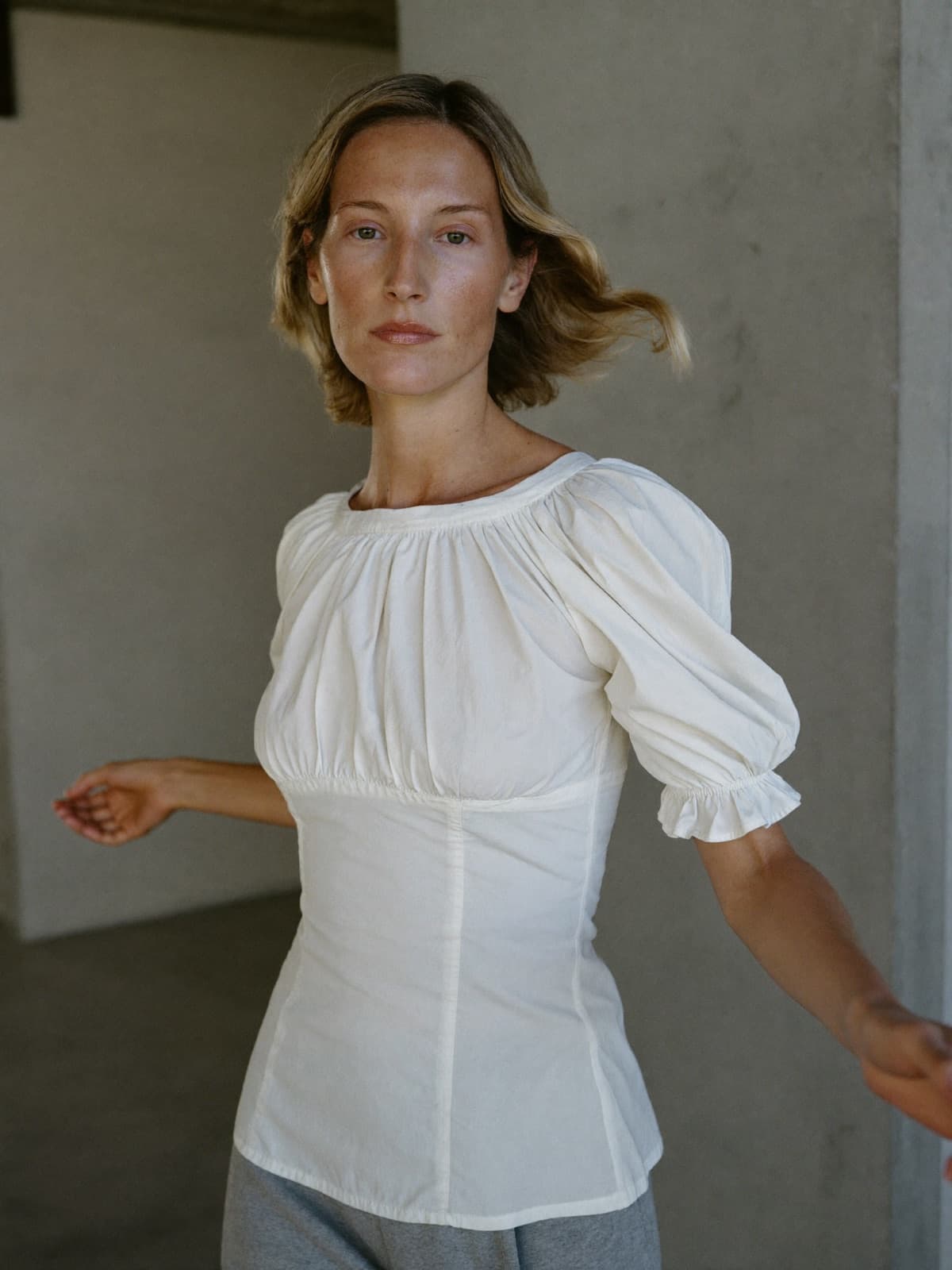 Agnès Peplum Top in White, worn on location