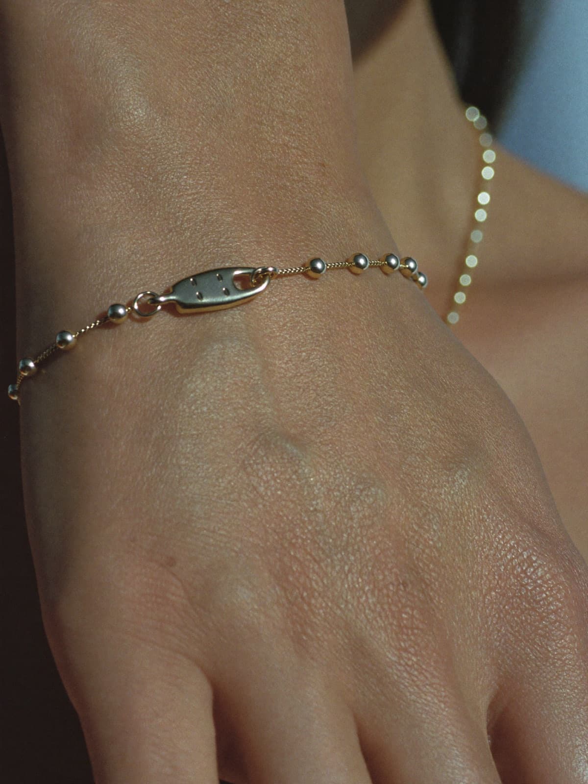 Cairn Beaded Bracelet in Gold, worn