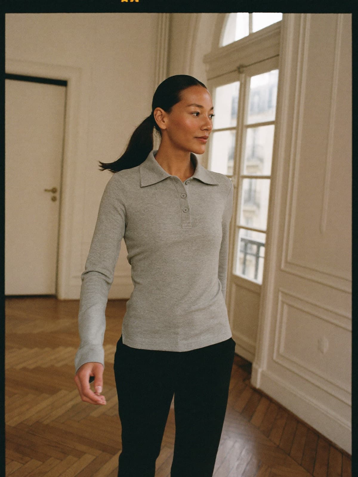 Greta Polo Tee in Grey Marl, worn on location