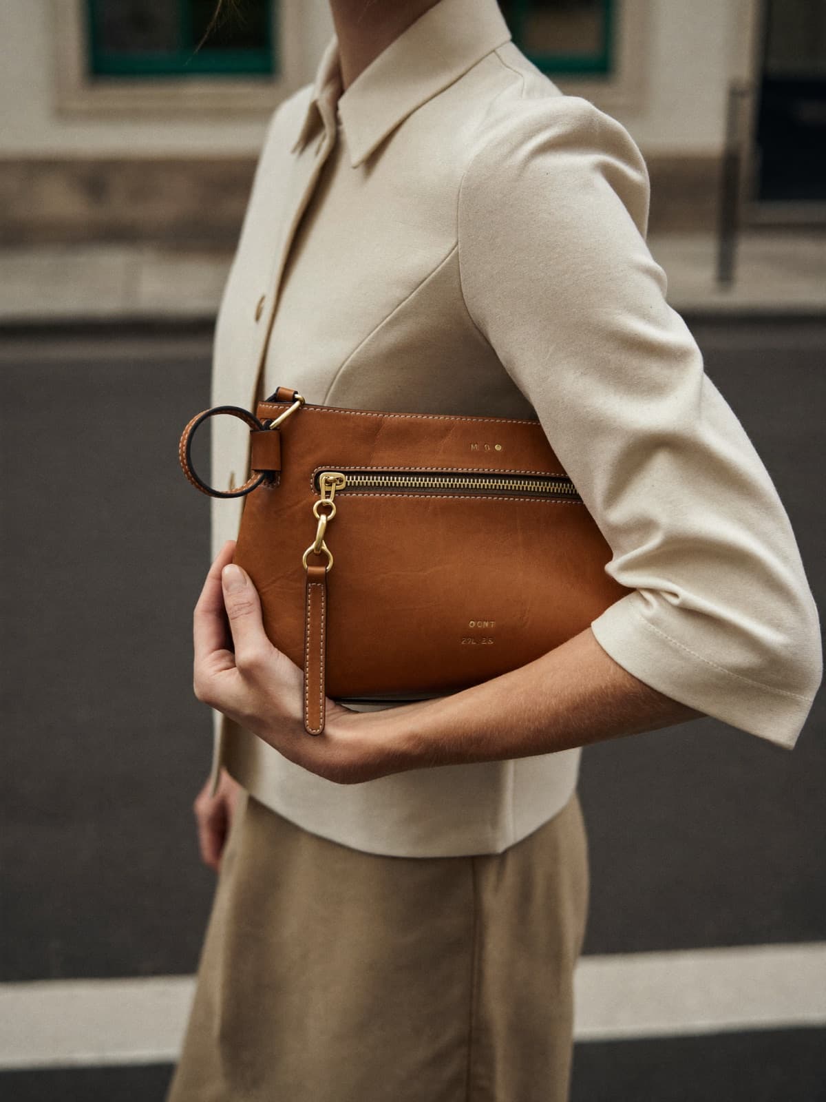 Ilka Coin Purse in Cognac, carried