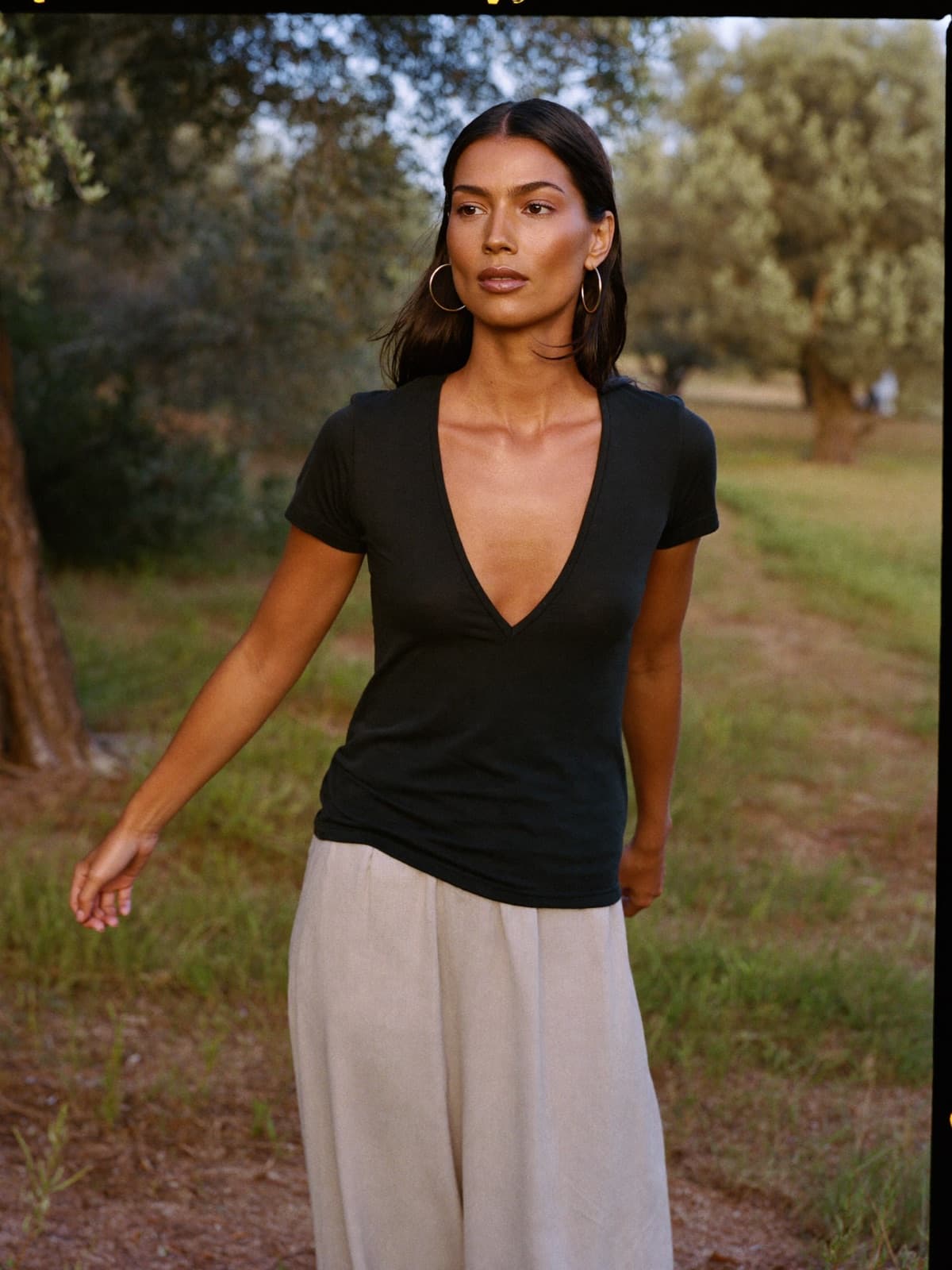 Jo V-Neck Tee in Black, worn on location