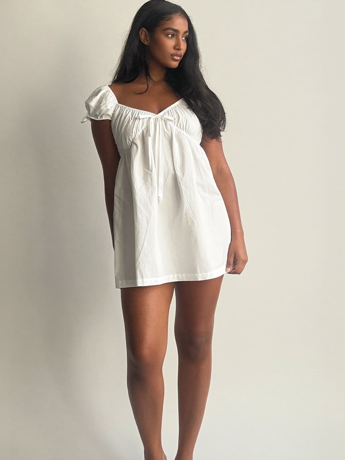 Juno Babydoll Dress in White, front view