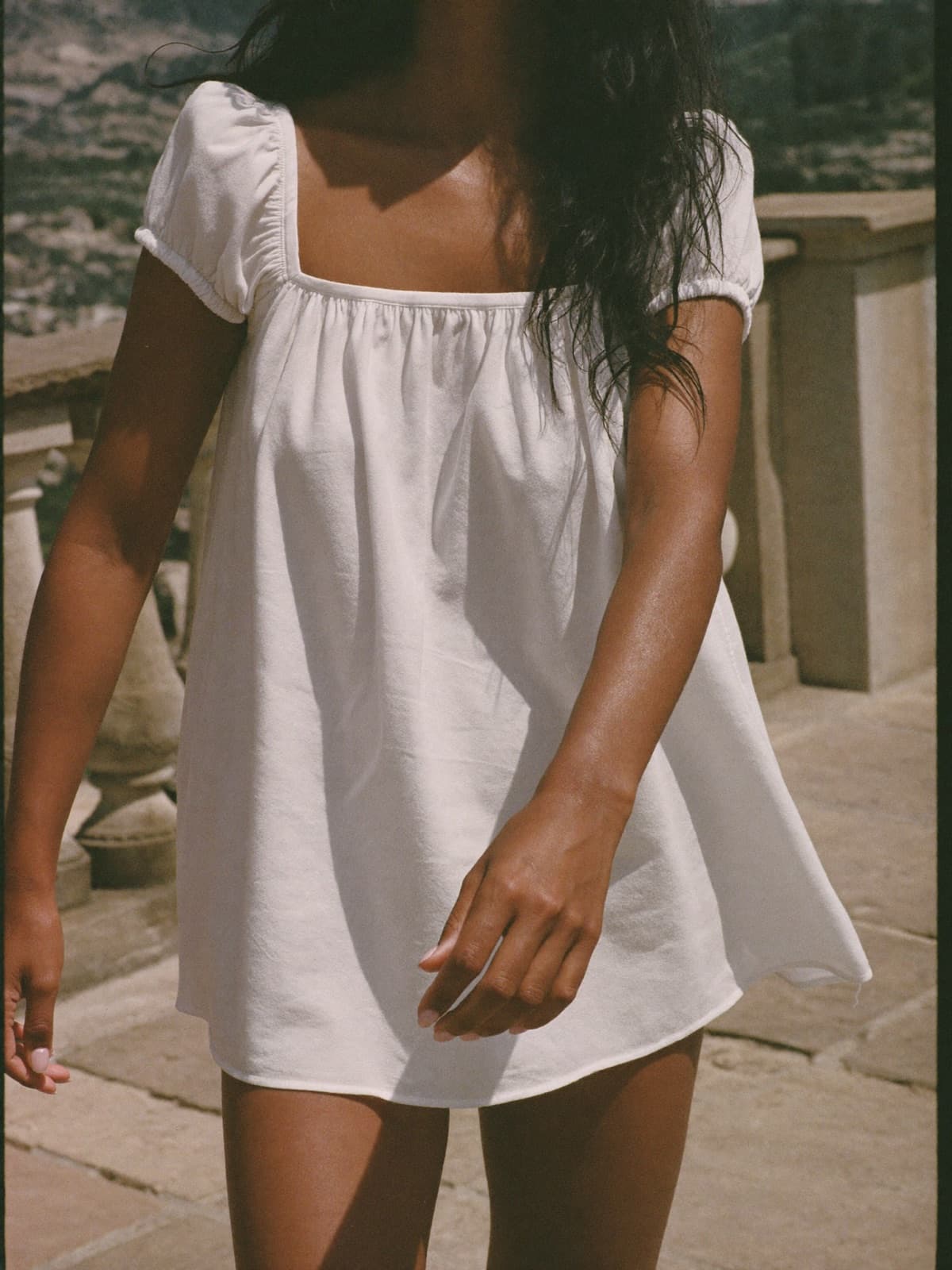Juno Babydoll Dress in White, worn on location