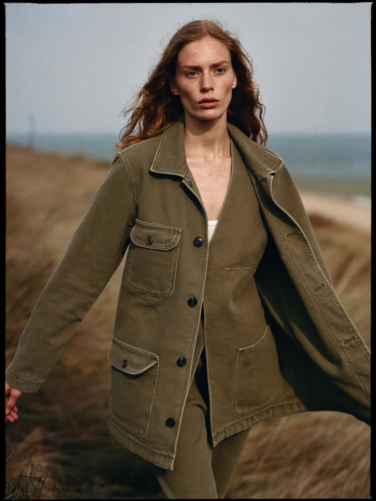 Nima Chore Jacket in Olive, worn on location