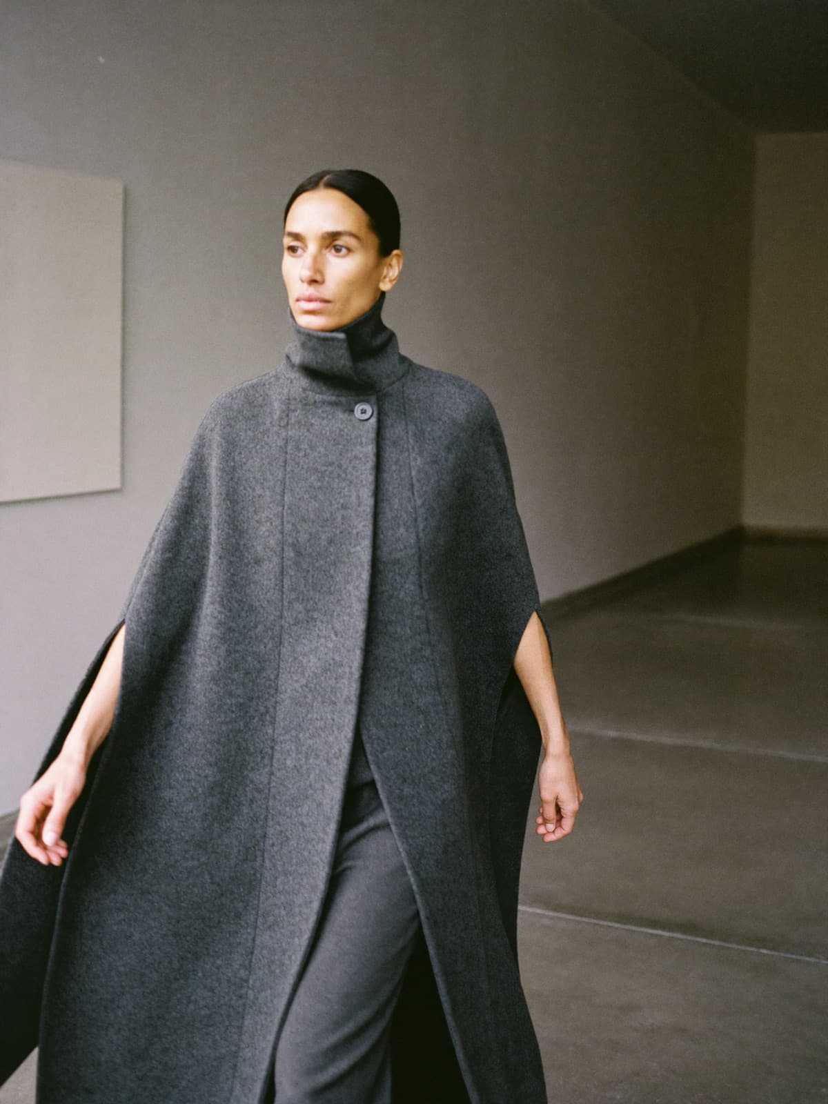Quilla Cape Coat in Charcoal, worn on location