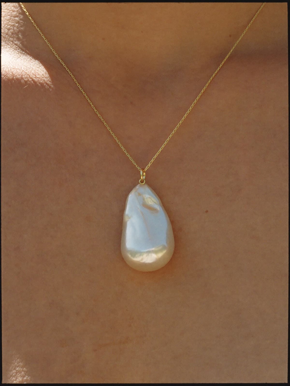 Sola Pearl Pendant in Gold, worn