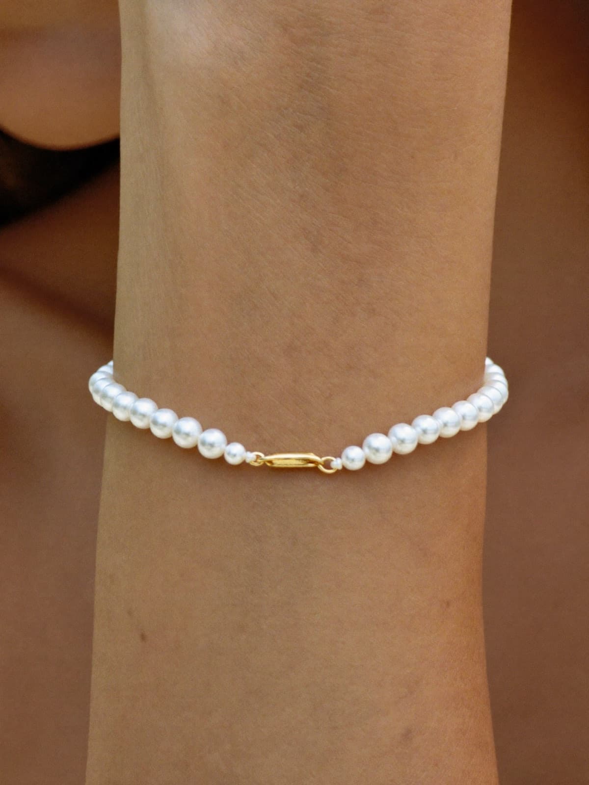 Tide Pearl Bracelet in Gold, worn
