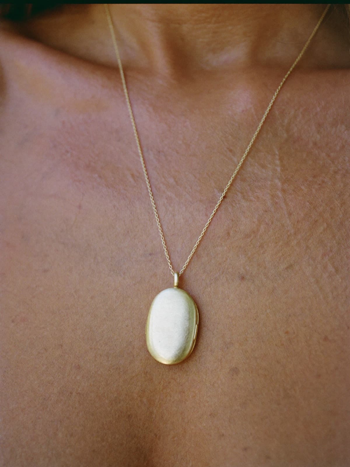 Vane Oval Locket in Gold, worn