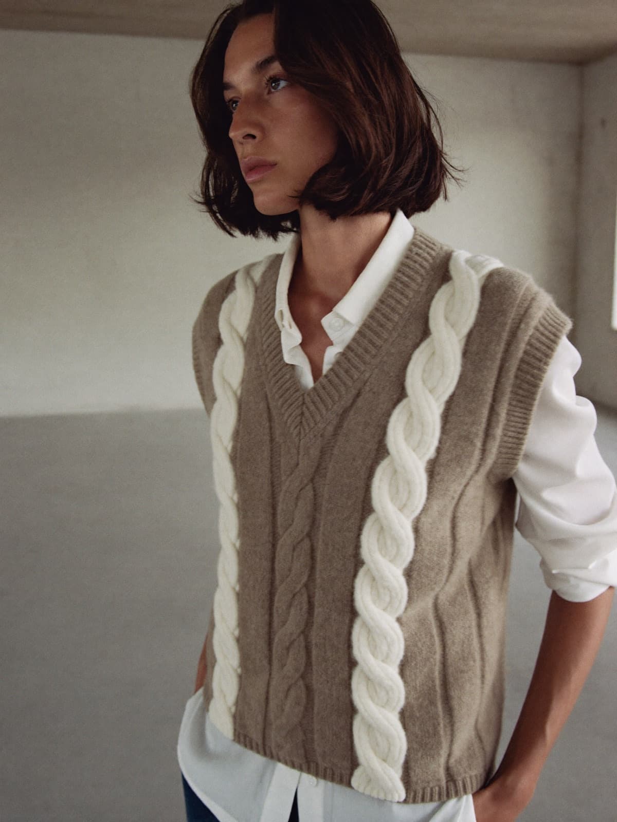 Vanja Cable Vest in Oat, worn on location